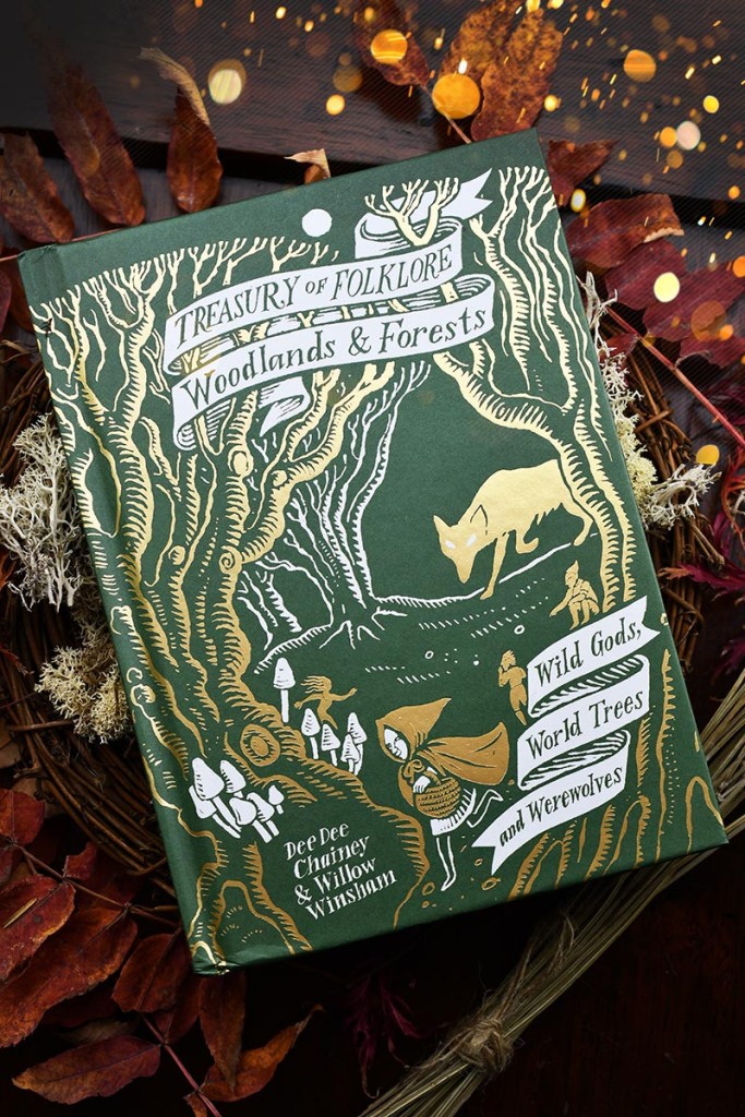 Photograph of a book titled Treasury of Folklore - Woodlands and Forests: Wild Gods, World Trees and Werewolves by Dee Dee Chainey and Willow Winsham of #FolkloreThursday